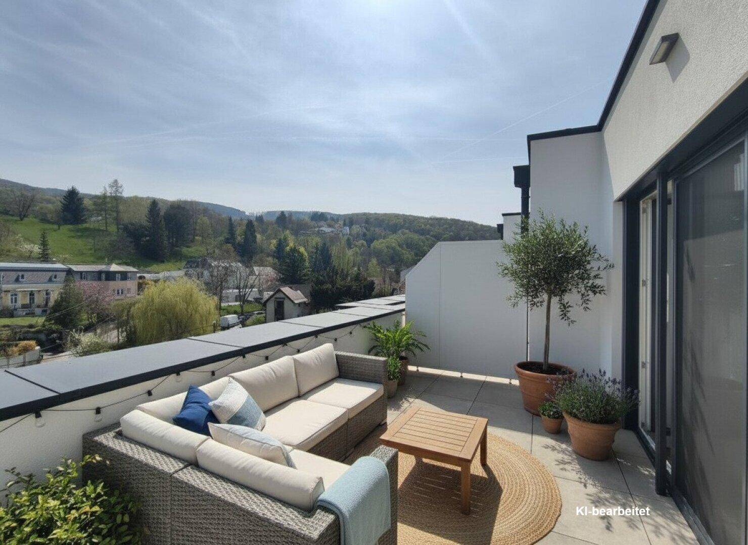 Sonnige Dachterrasse mit bequemen Loungemöbeln und weitem Blick ins Grüne.