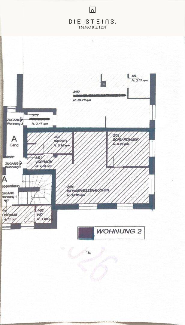 Grundriss der Wohnung 2 mit Schlafzimmer, offenem Wohn-/Kochbereich und Bad/WC.