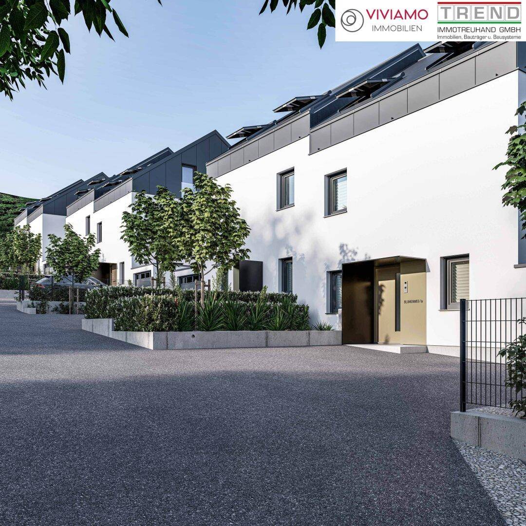 Visualisierung des Eingangsbereichs einer modernen Reihenhaussiedlung mit gepflegter Zufahrt.