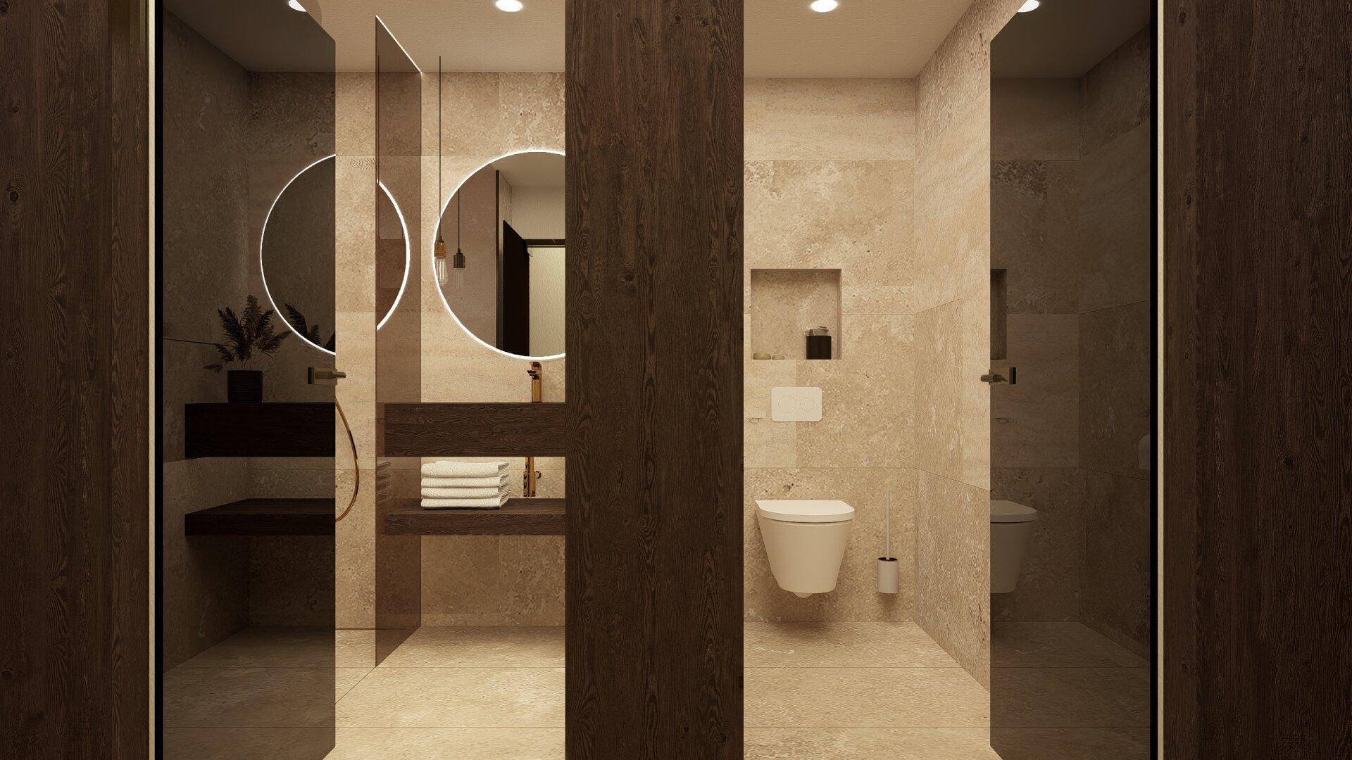 Modernes Badezimmer mit zwei Duschbereichen, WC und beleuchtetem Spiegel über dem Waschtisch.