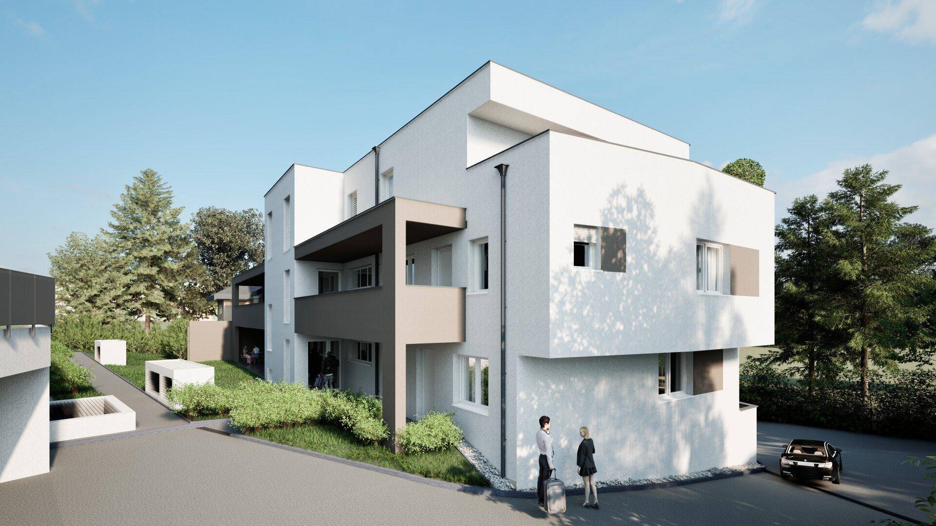 Neubau-Wohngebäude mit moderner Architektur, umgeben von Grünflächen und Bäumen.