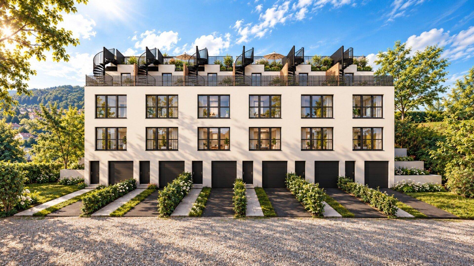 Moderne Reihenhausanlage mit Garagen, begrünten Vorgärten und Dachterrassen.