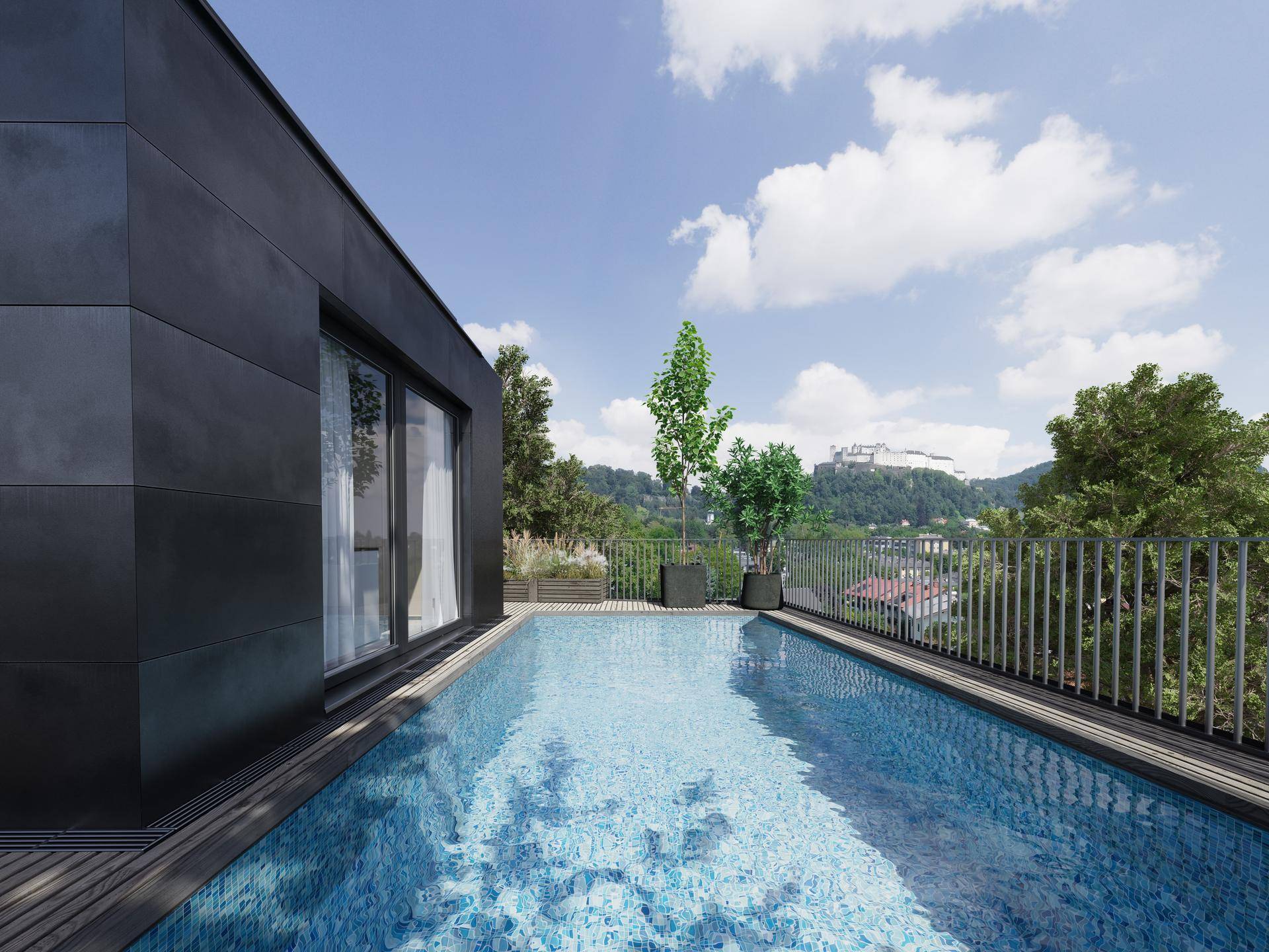 Dachterrasse mit Infinity-Pool und Panoramablick auf die umliegende Landschaft und eine historische Burg.