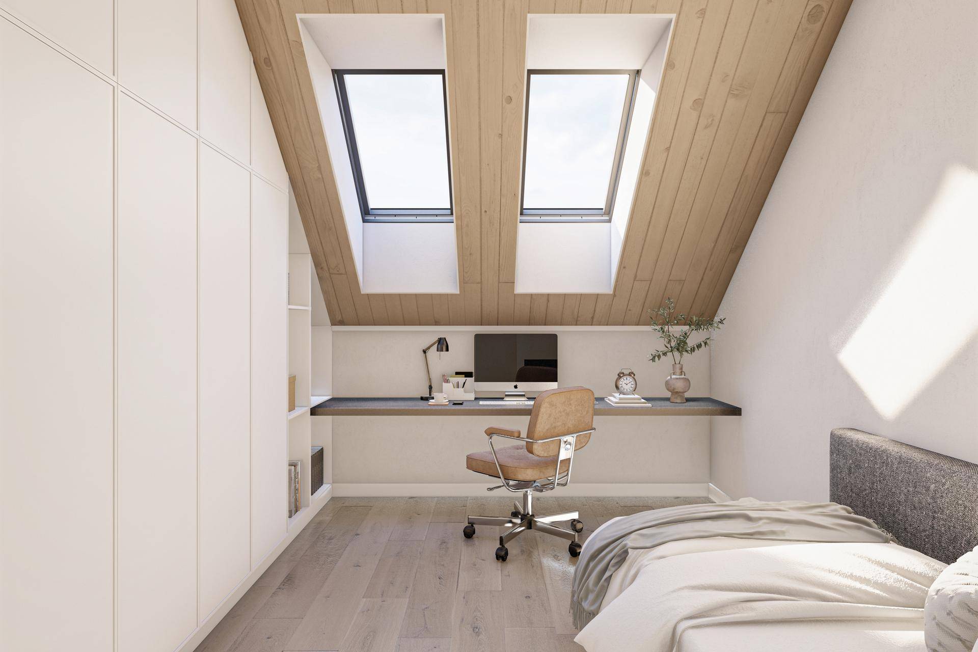 Helles Schlafzimmer mit Dachschrägen, zwei Dachfenstern und integriertem Arbeitsbereich.