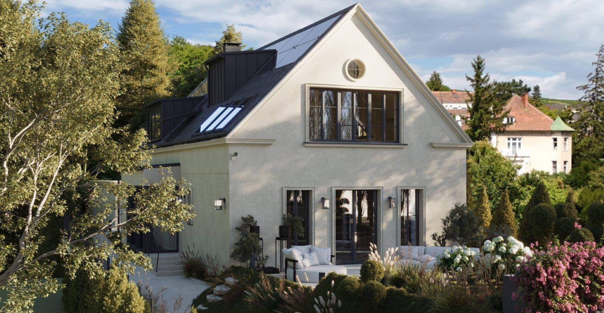 Modernes Haus mit großzügiger Terrasse, Garten und Blick auf die umliegende Landschaft.