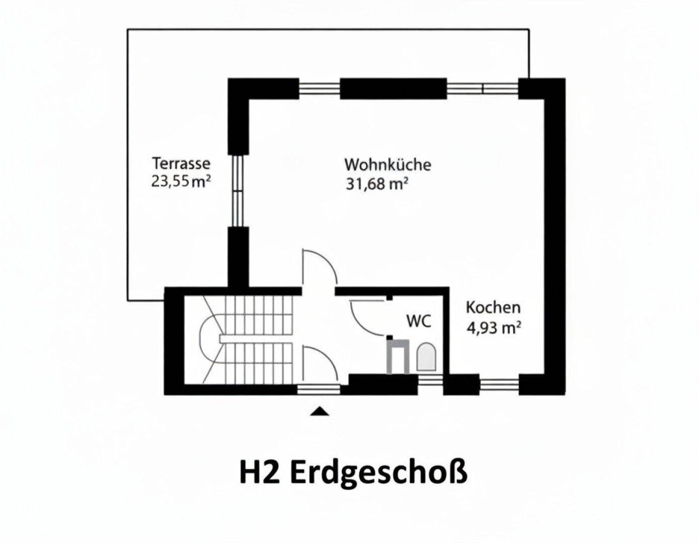 Grundriss des Erdgeschosses mit offener Wohnküche, Terrasse und WC.