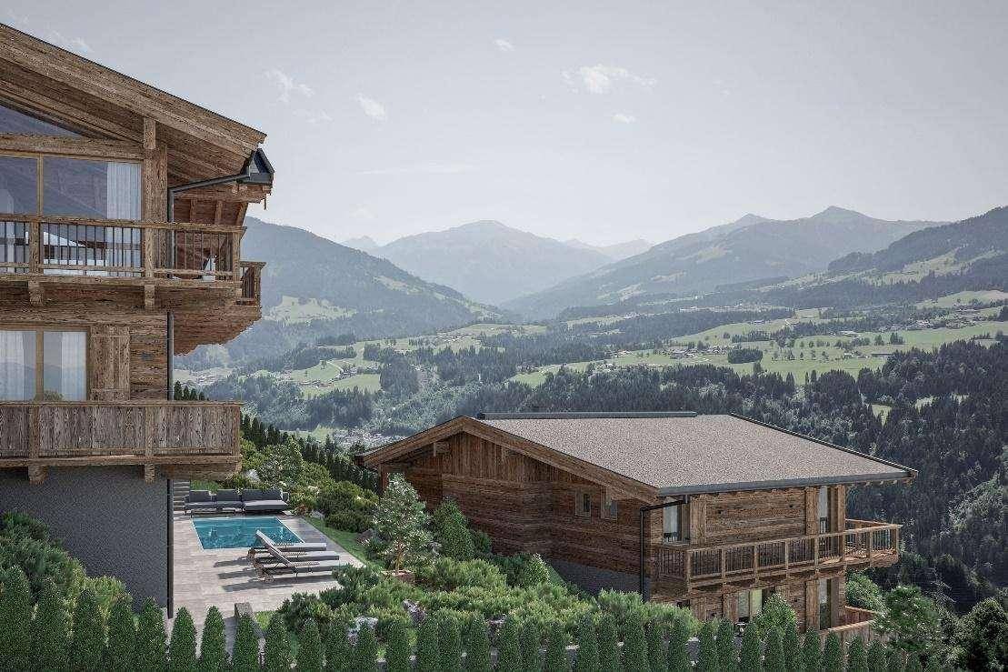 Luxuriöses Chalet mit Infinity-Pool und atemberaubendem Blick auf die Alpenlandschaft.