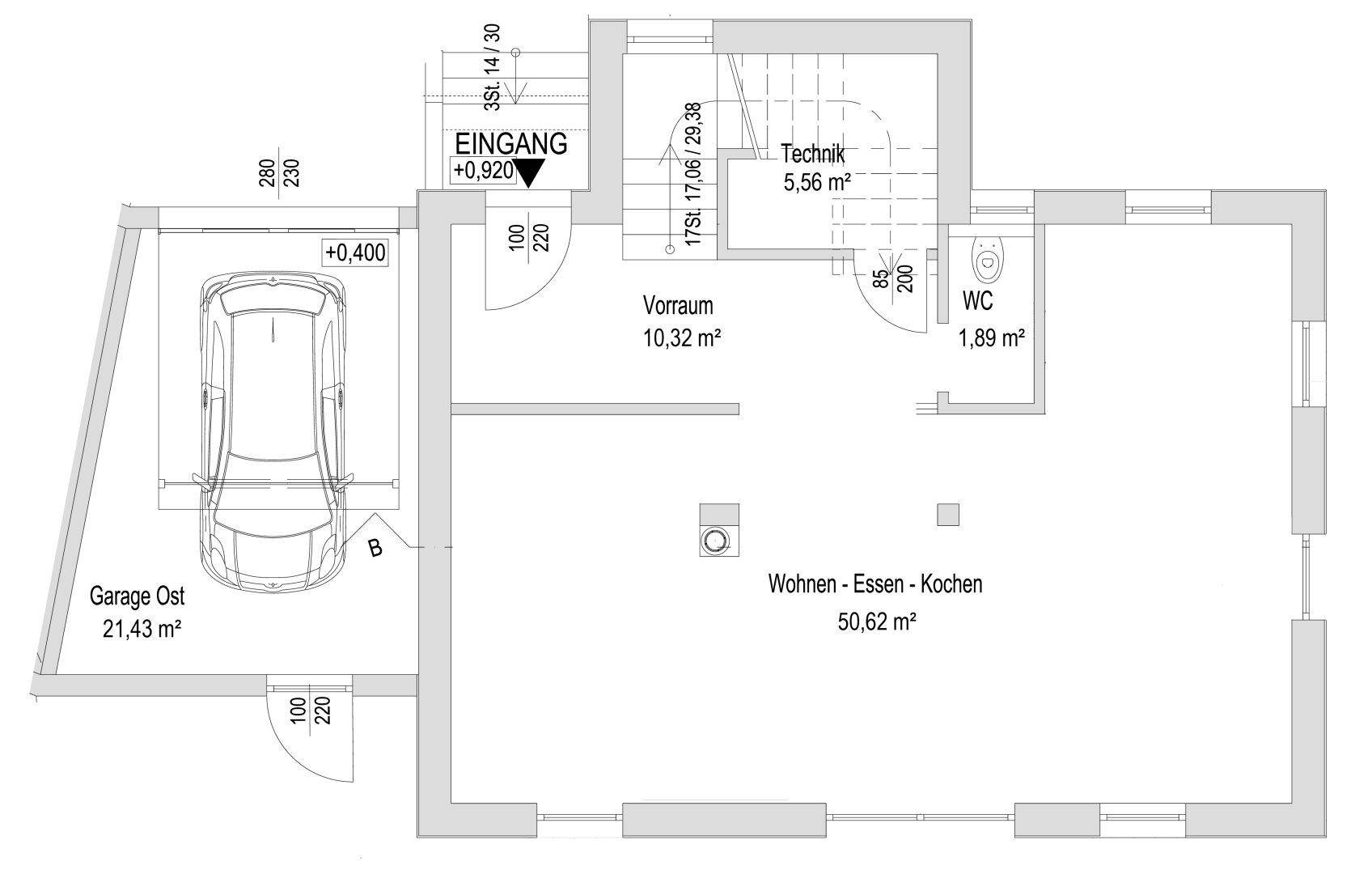 Grundriss des Erdgeschosses mit offenem Wohn-Ess-Kochbereich, Garage und WC.