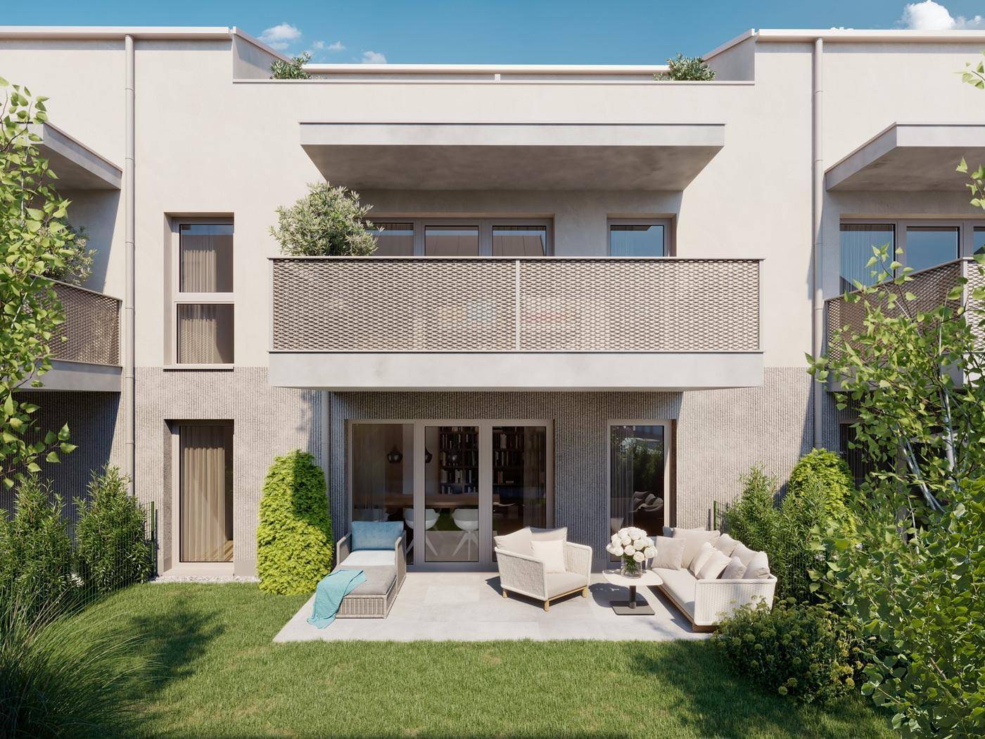 Erdgeschoss-Terrasse mit modernen Gartenmöbeln und Zugang zum Garten, darüber ein Balkon.