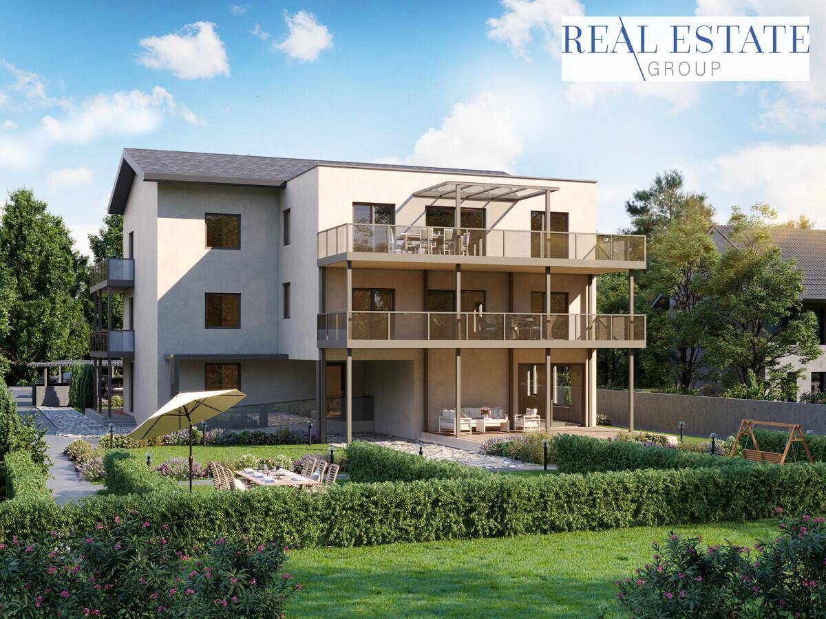 Gerenderte Ansicht eines modernen Wohnhauses mit mehreren Balkonen und Gartenbereich.