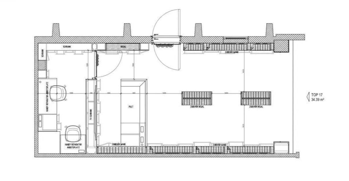 Grundrissplan eines Geschäftslokals mit offenem Verkaufsbereich und separatem Lagerraum.