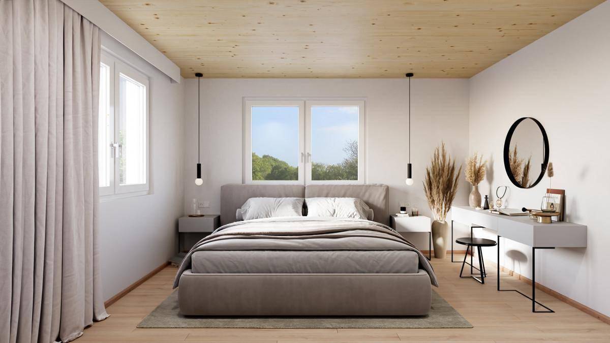 Helles Schlafzimmer mit Holzbalkendecke, großem Bett und modernem Schminktisch am Fenster.