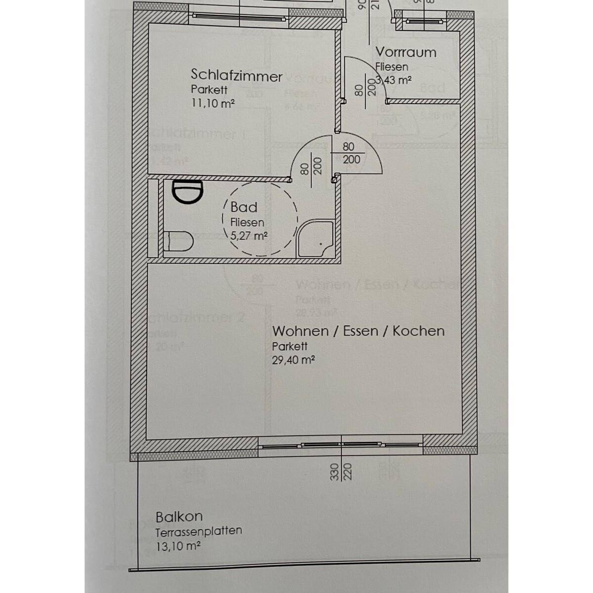 Grundrissplan einer Wohnung mit Schlafzimmer, Bad, offenem Wohnbereich und Balkon.