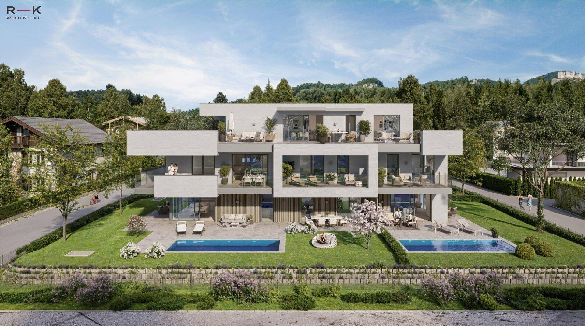 Weitläufige Wohnanlage mit zwei Pools, gepflegten Gärten und malerischem Bergblick.