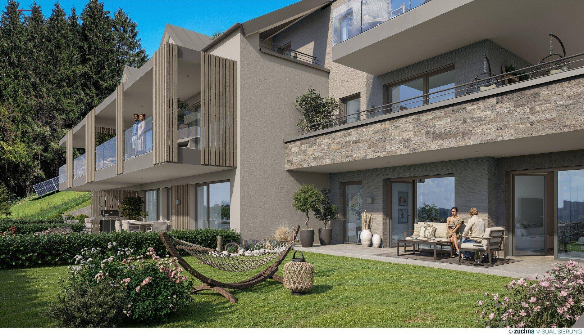 Gepflegter Gartenbereich mit Terrasse, Sitzgelegenheiten und Hängematte vor der modernen Fassade.