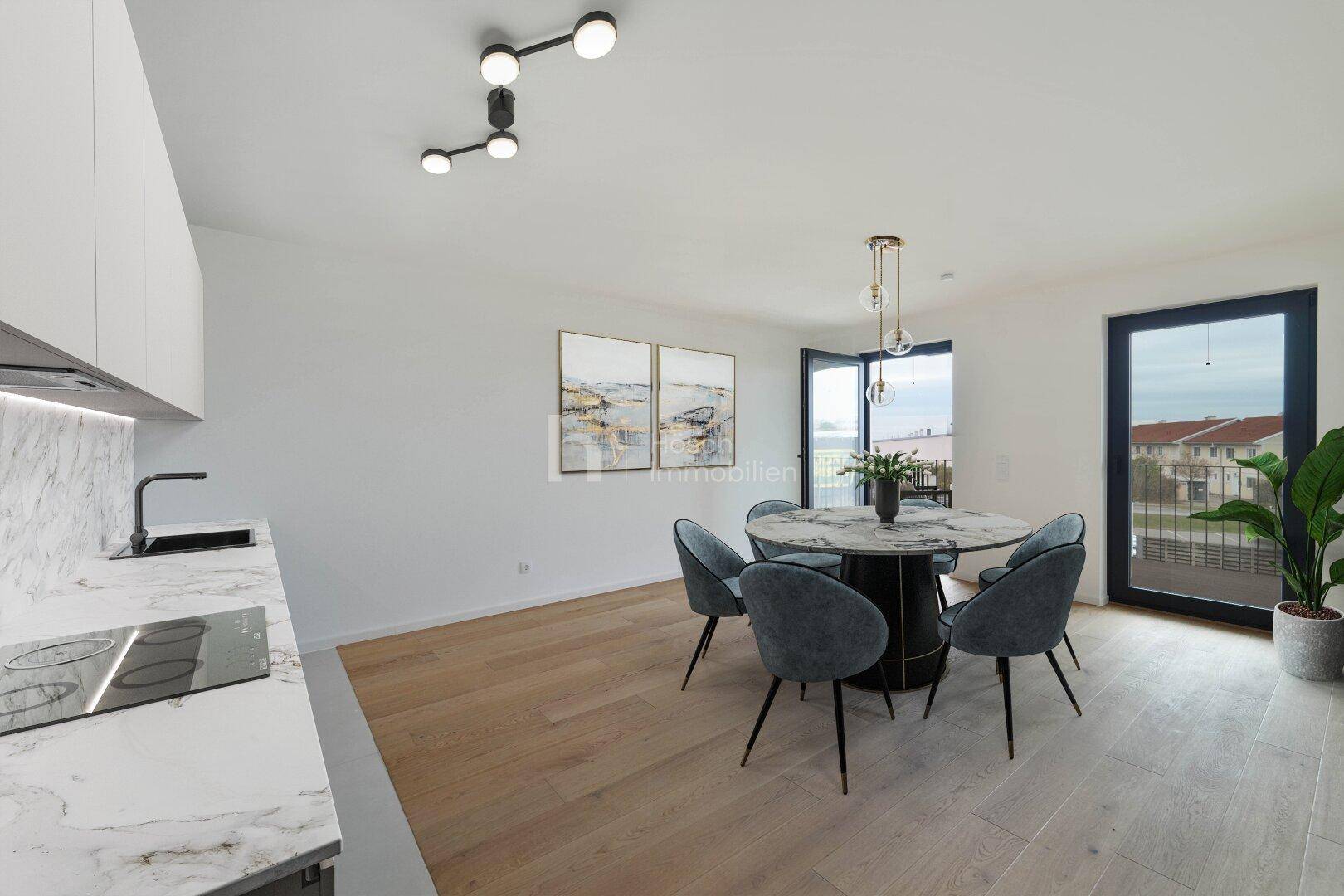 Moderne Küche mit Marmorarbeitsplatte, Essbereich und Zugang zum Außenbereich.