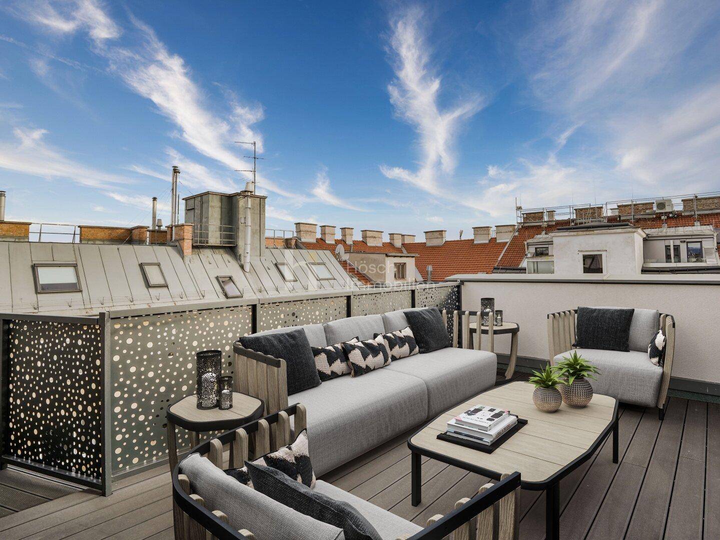 Möblierte Dachterrasse mit bequemen Sitzgelegenheiten und Blick über die städtischen Dächer.