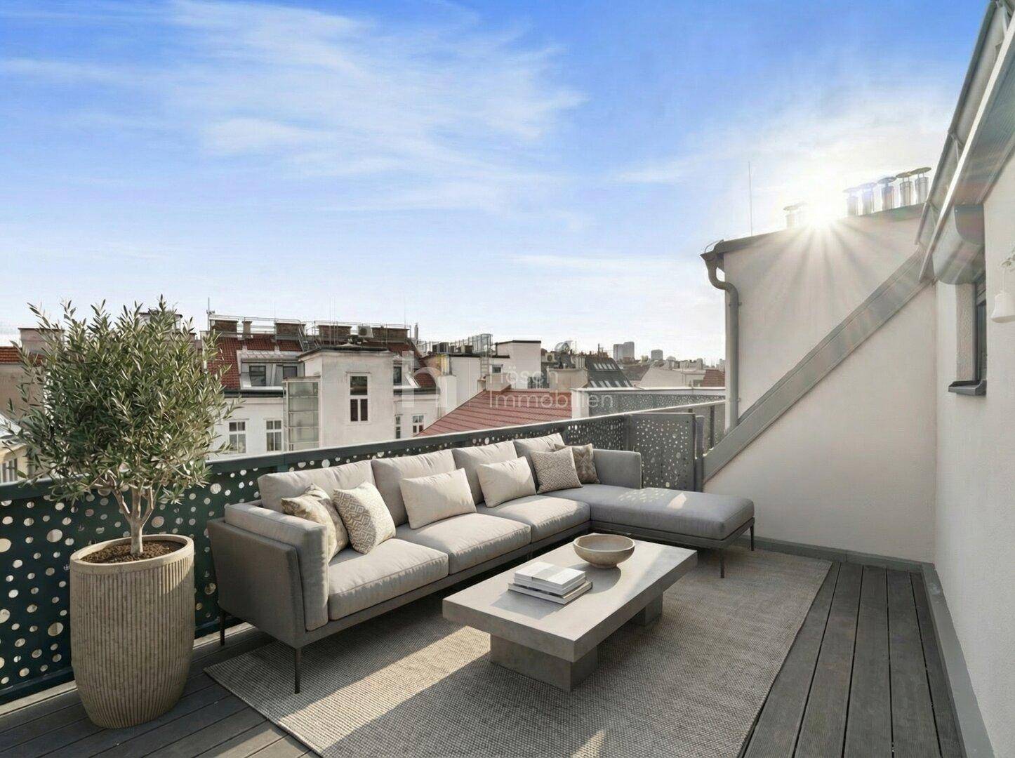 Sonnige Dachterrasse mit moderner Lounge-Möblierung und weitem Blick über die Stadt.