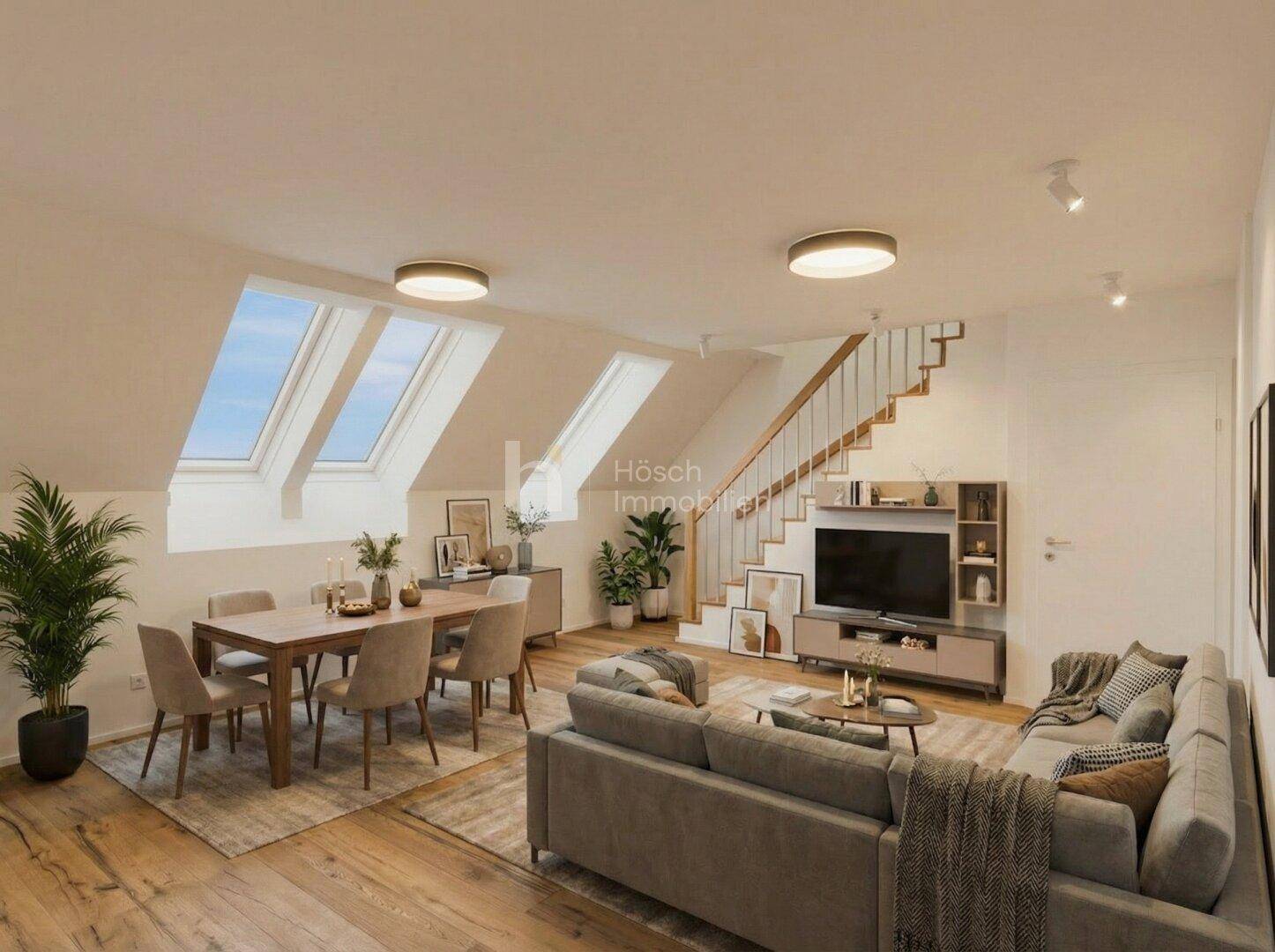 Geräumiger Wohn-Essbereich im Dachgeschoss mit Schrägfenstern und Holztreppe.