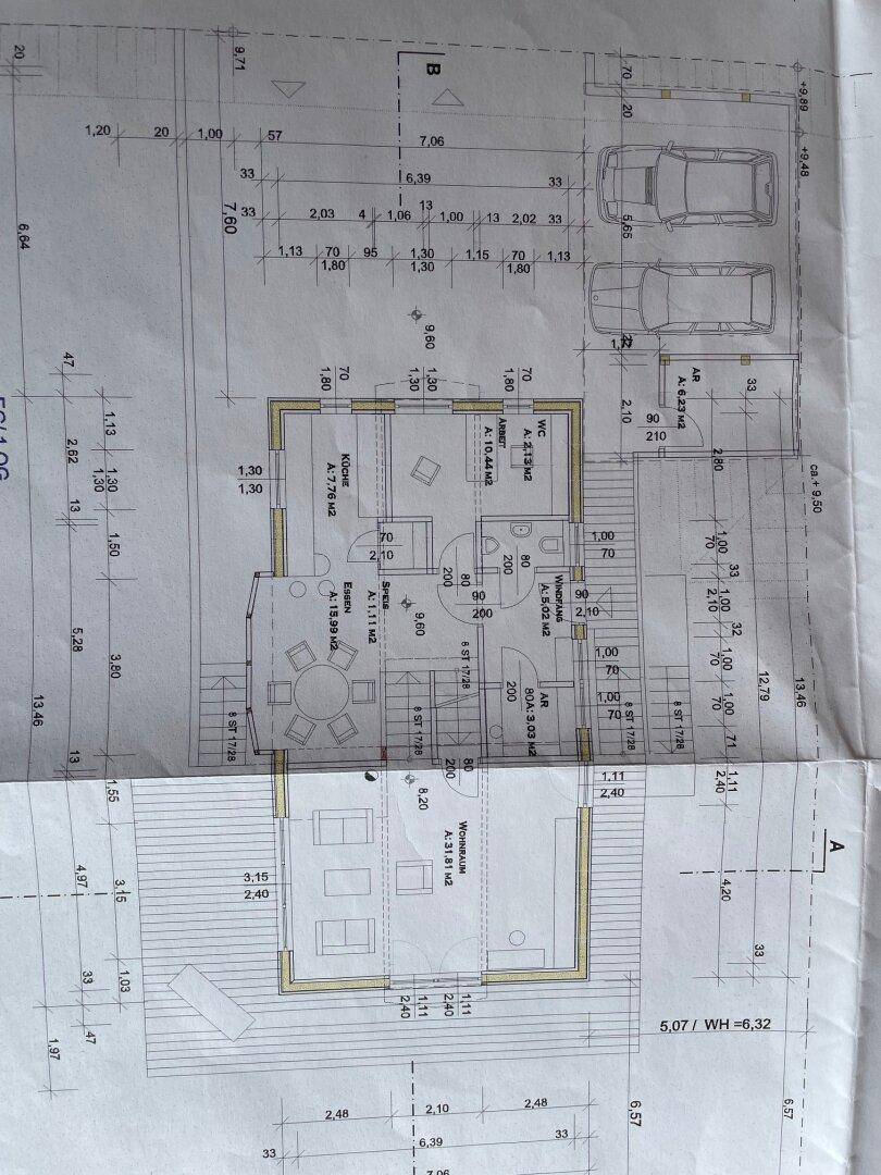 Grundriss des Erdgeschosses mit offenem Wohn-Essbereich und Küche.