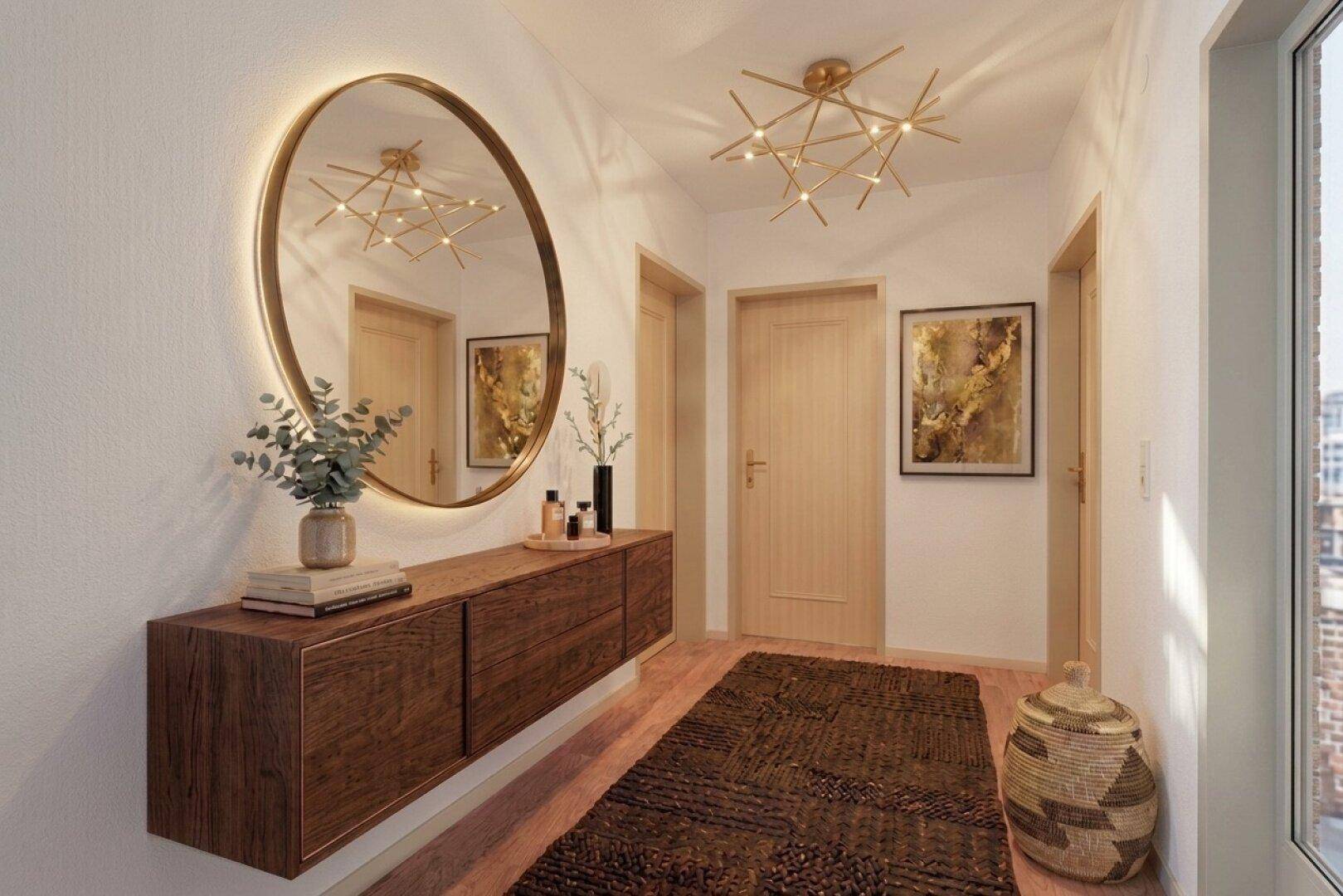 Stilvoller Eingangsbereich mit großem Rundspiegel, Holzkonsole und modernem Design.