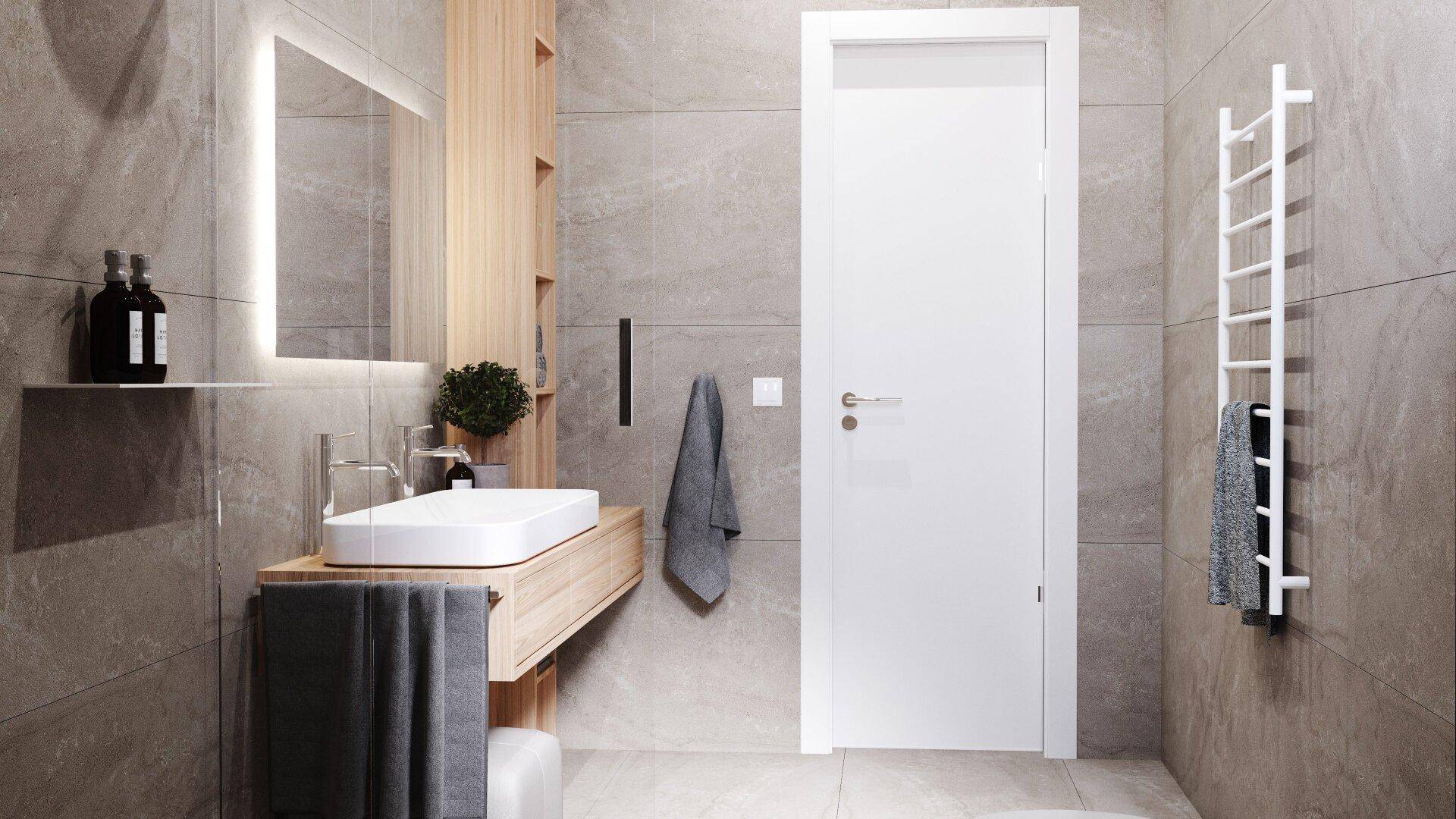 Modernes Badezimmer mit grauen Fliesen, beheiztem Handtuchhalter und Einzelwaschbecken.
