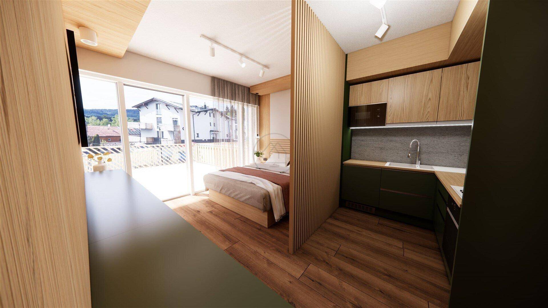 Helles Schlafzimmer mit Holzboden, Zugang zum Balkon und integrierter Küchenzeile.