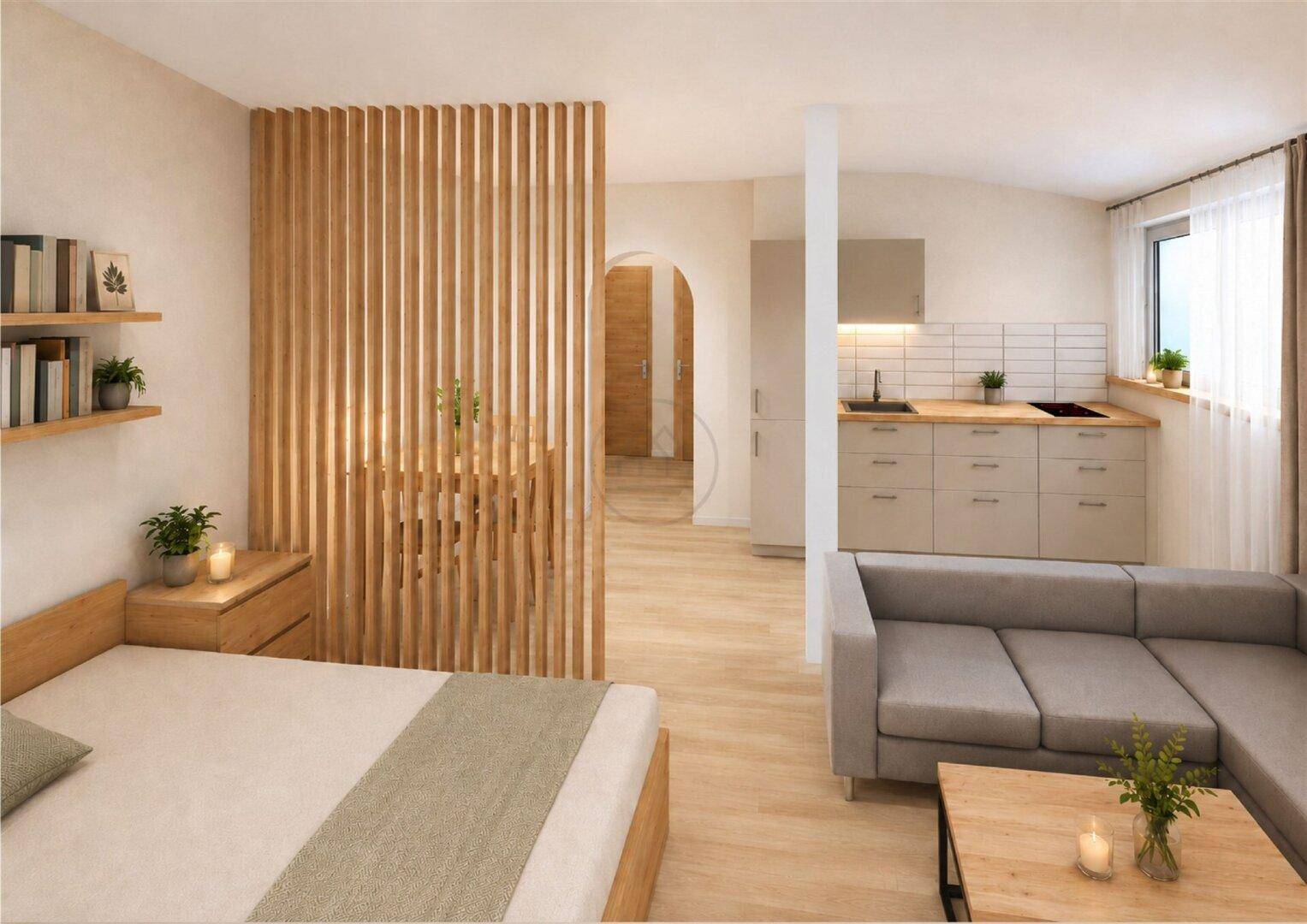 Offenes Studio-Apartment mit Schlafbereich, Wohnbereich und integrierter Küchenzeile.