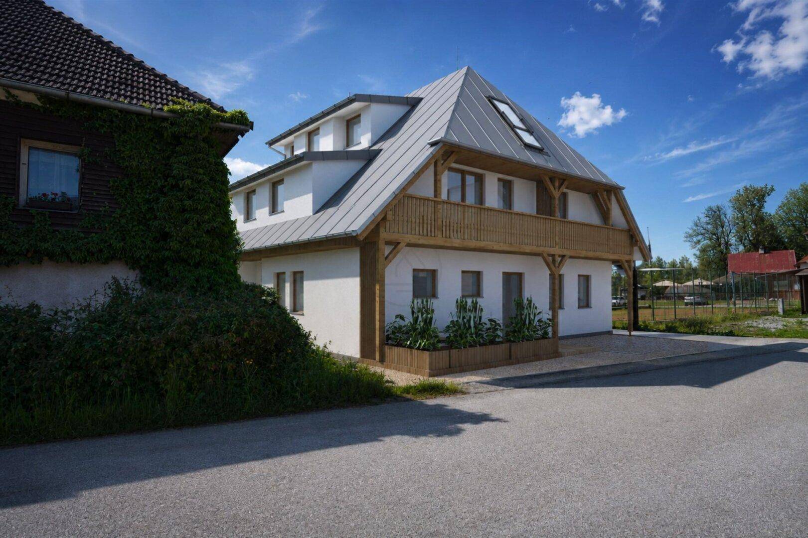 Ansicht des modernen Hauses mit Holzelementen und Balkonen, neben einem älteren Gebäude mit Efeu.