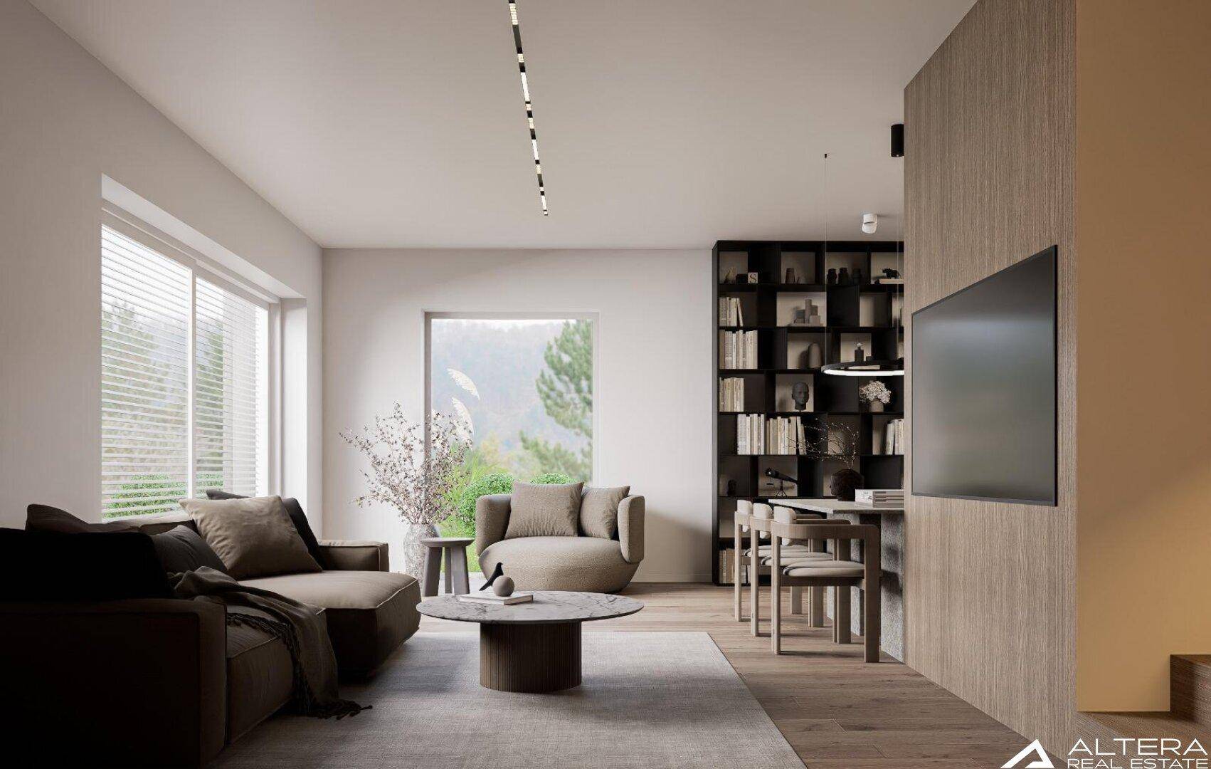 Helles Wohnzimmer mit großen Fenstern, Blick ins Grüne und integriertem Bücherregal.