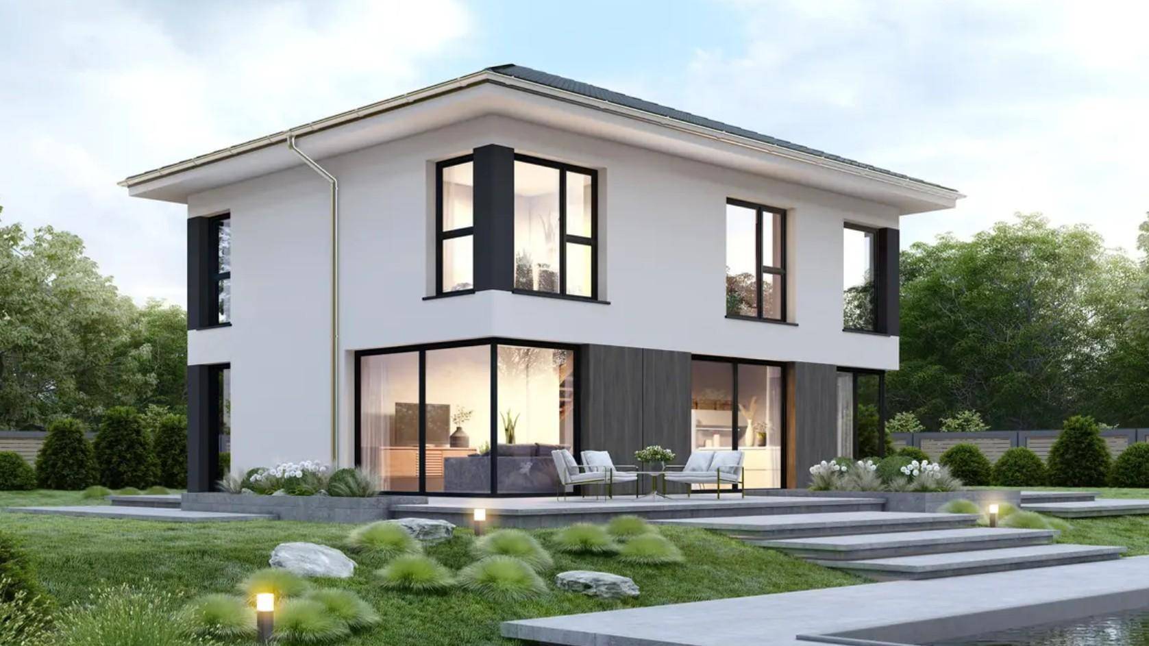 Modernes Einfamilienhaus mit weißer Fassade, großen Glasfronten und einer möblierten Terrasse im Grünen.