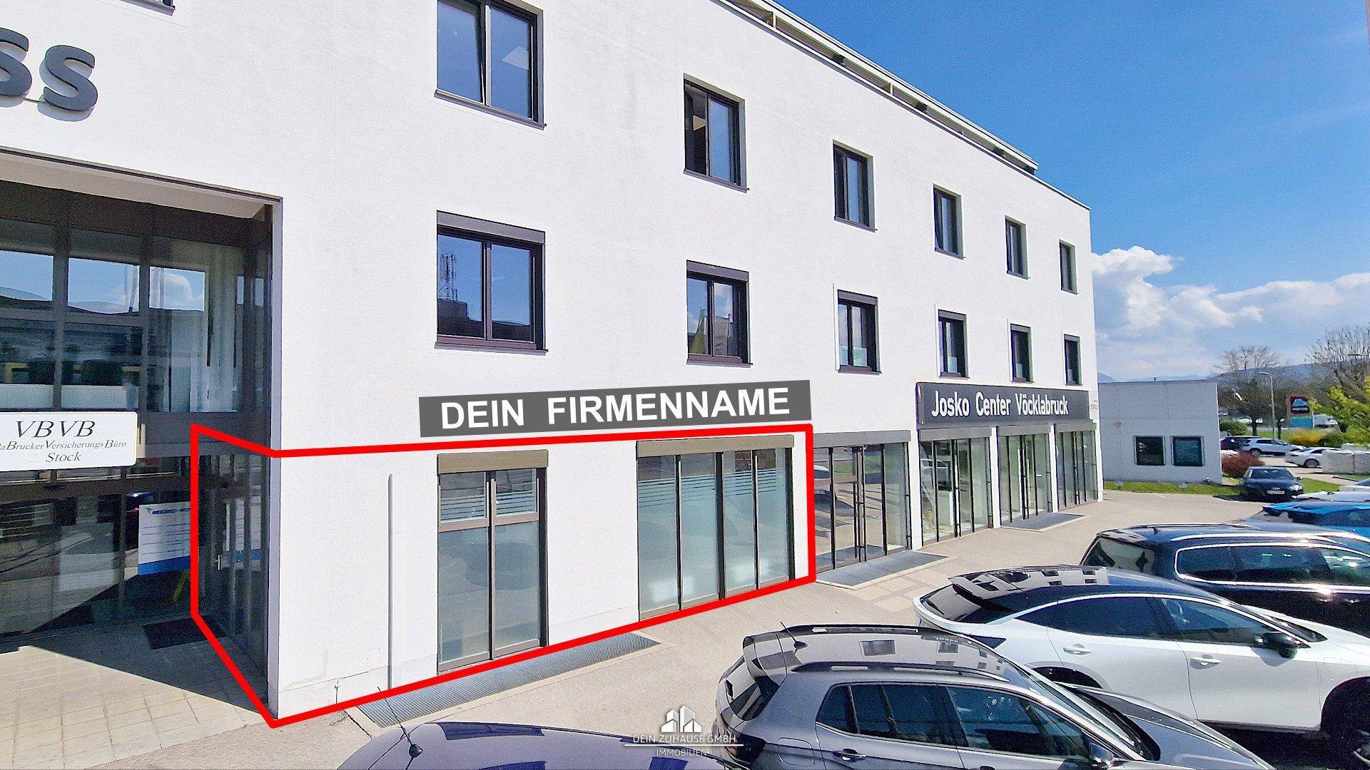 Moderne Geschäftsfassade mit großen Fenstern und einem rot markierten Bereich für eine Ladenfläche.