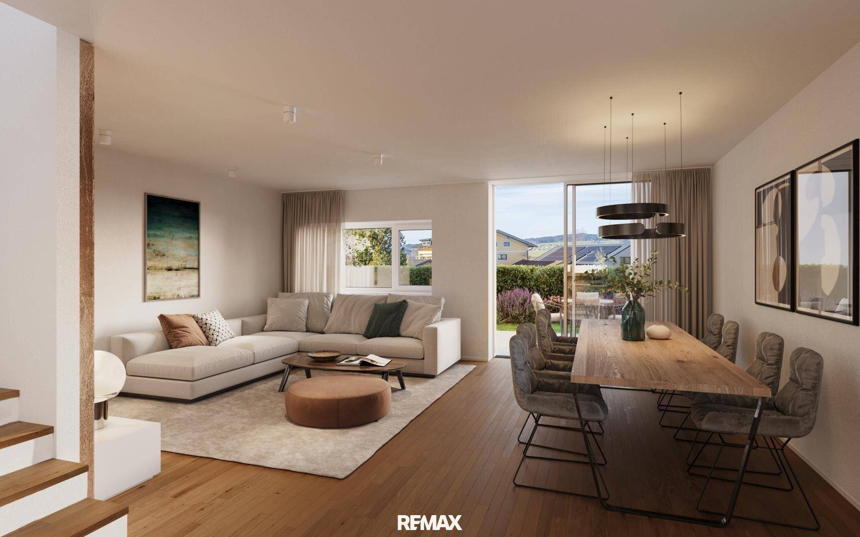 Heller, offener Wohn-Essbereich mit Holzboden, bequemer Couch und Zugang zur Terrasse.