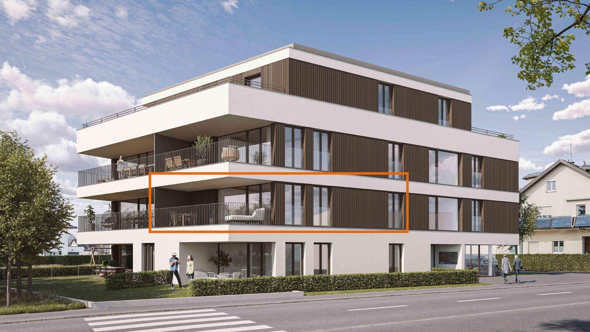 Modernes Mehrfamilienhaus mit Balkonen und zeitgenössischer Architektur in grüner Umgebung.