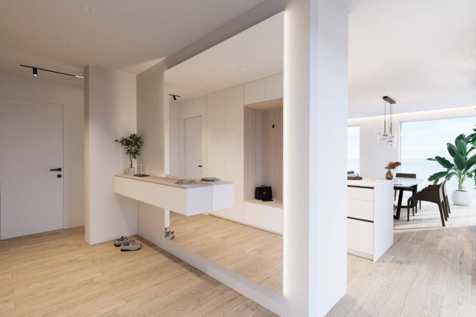 Geräumiger Eingangsbereich mit moderner Konsole, Garderobe und Blick in den Wohnbereich.