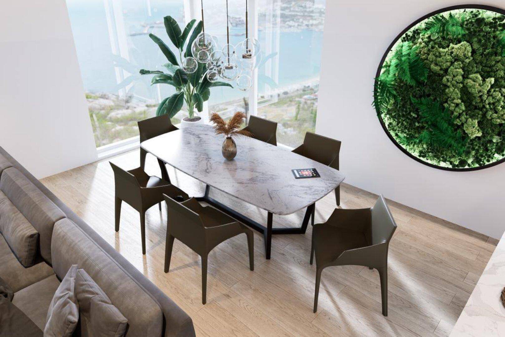Eleganter Essbereich mit großem Tisch, modernen Stühlen und Panoramablick durch große Fenster.