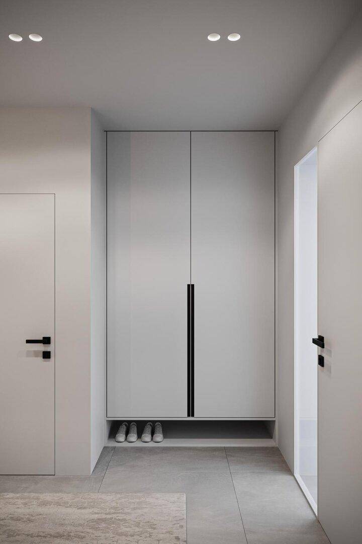 Eingangsbereich mit integriertem Einbauschrank und Ablagefläche für Schuhe.