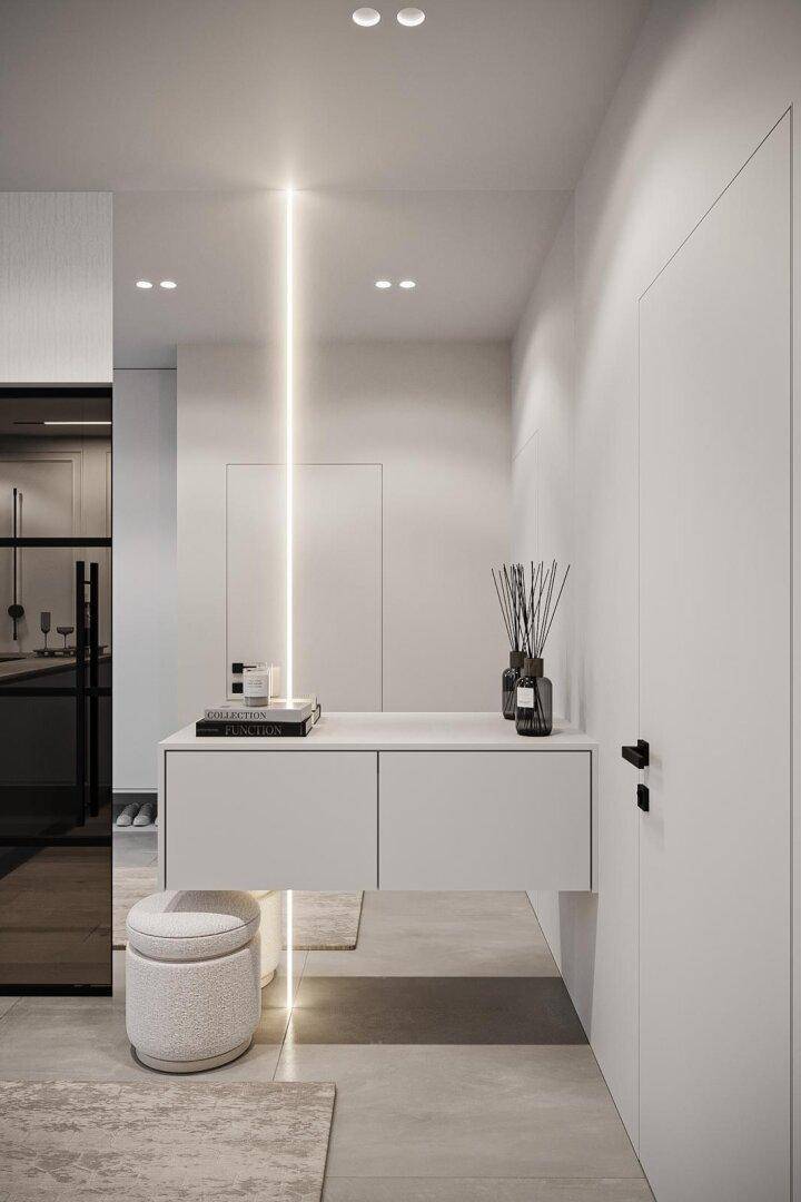 Moderner Eingangsbereich mit beleuchteter Konsole, dekorativen Elementen und minimalistischem Design.
