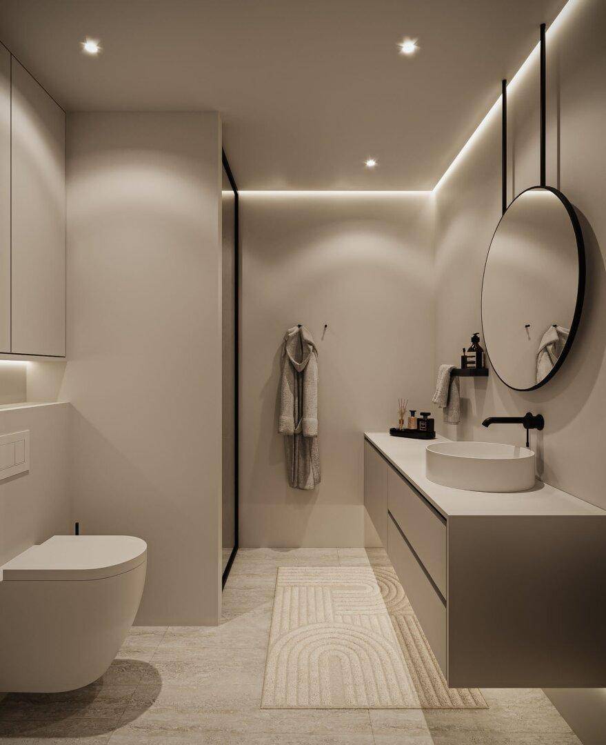 Helles Badezimmer mit modernem Waschtisch, Spiegel, WC und begehbarer Dusche.