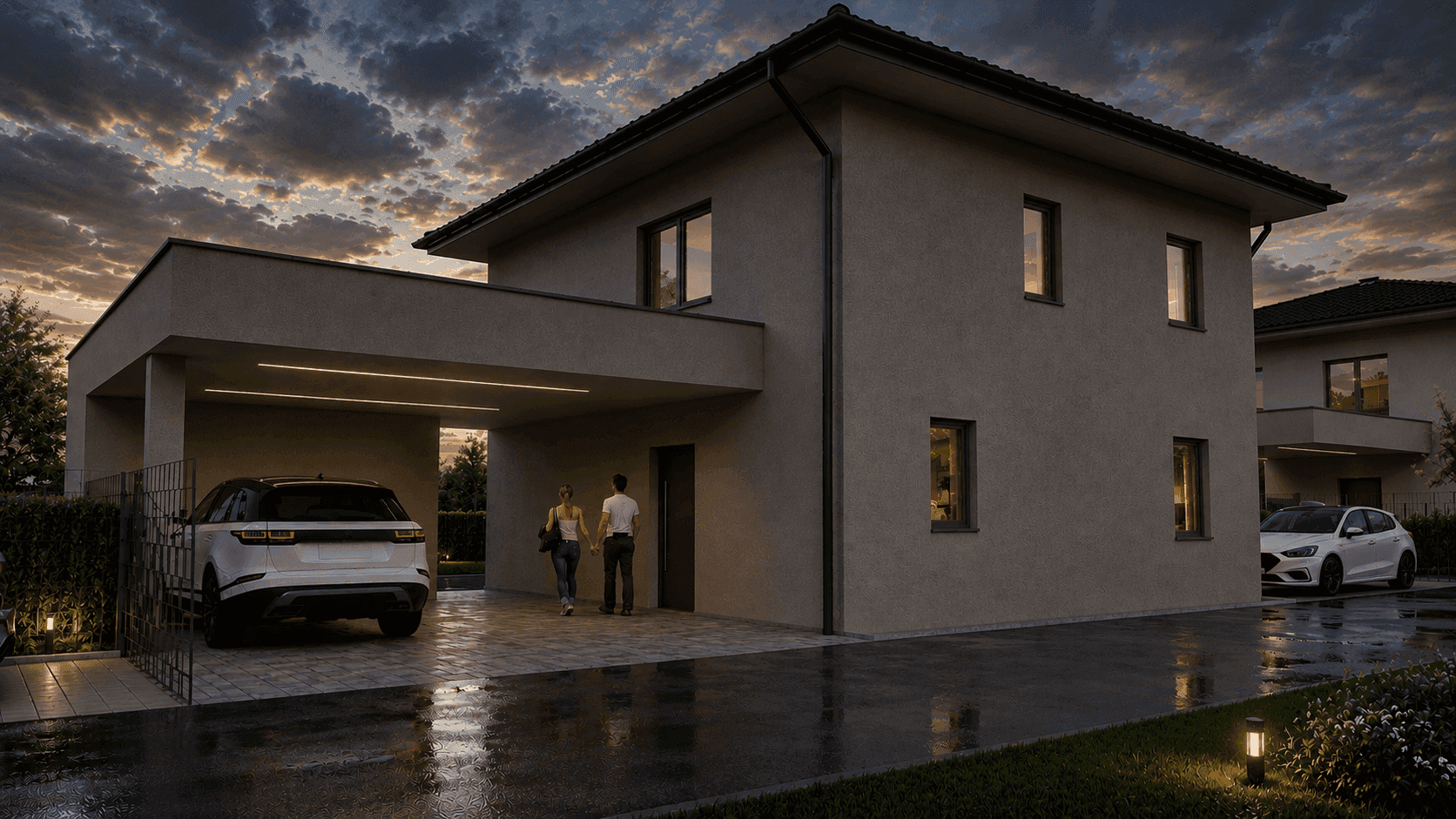 Abendliche Ansicht des modernen Einfamilienhauses mit beleuchtetem Carport und gepflasterter Zufahrt.