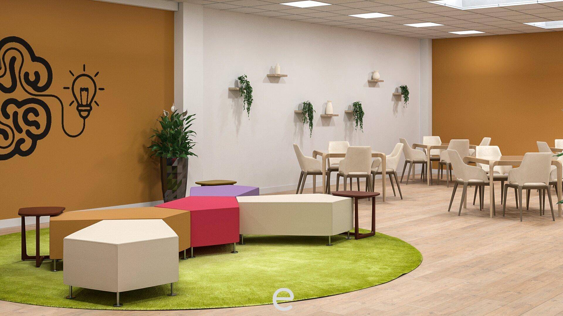 Offener Lounge-Bereich mit farbigen Sitzgelegenheiten, Esstischen und einer Küchenzeile.