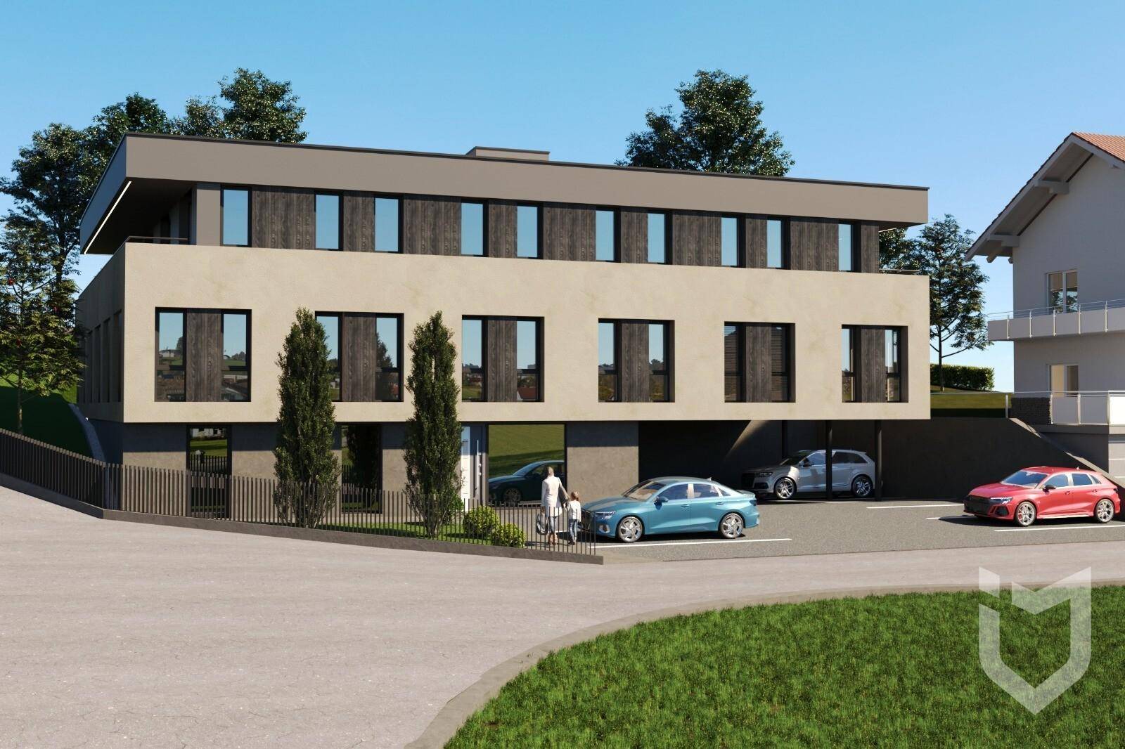 Ansicht der modernen Wohnanlage von der Straße mit Parkplätzen und Zufahrt.