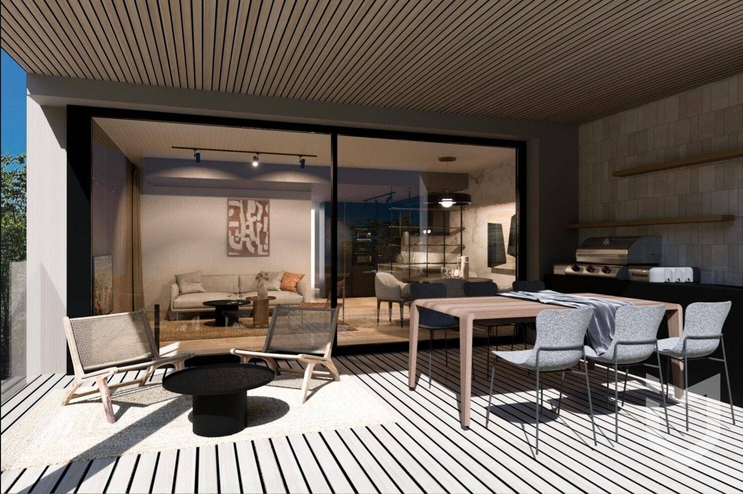 Geräumige Terrasse mit Essbereich und Lounge-Möbeln, ideal für entspannte Stunden im Freien.