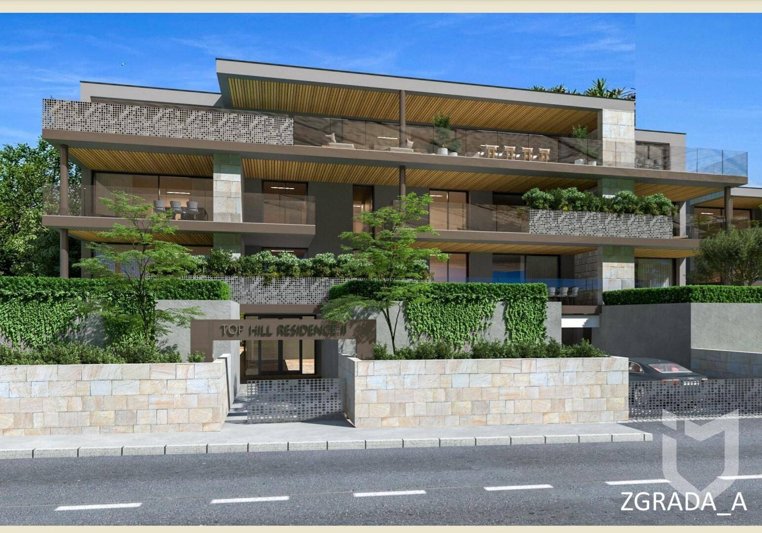 Ansicht der modernen Wohnanlage 'Top Hill Residence' mit Steinfassade und großzügigen Balkonen.