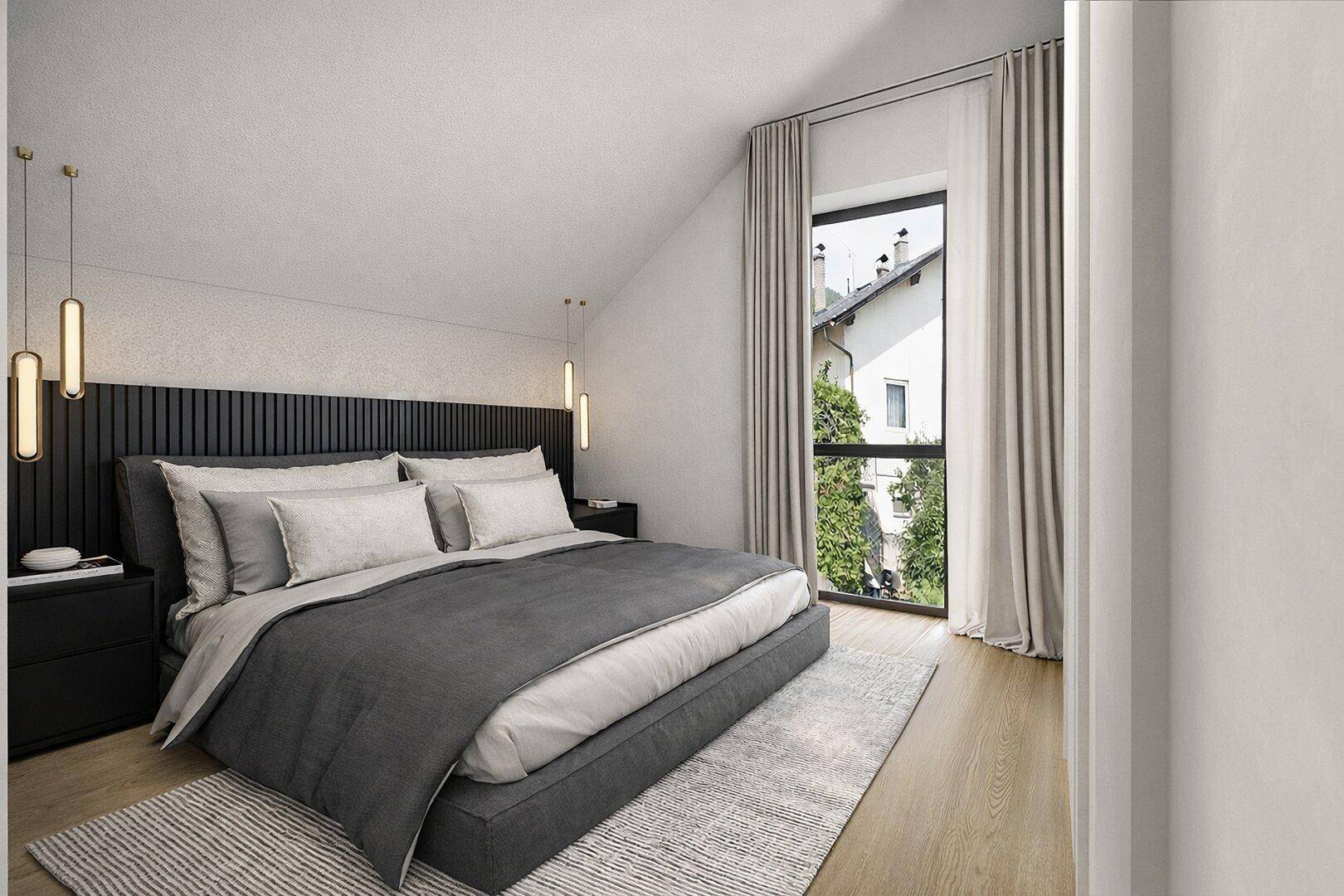 Helles Schlafzimmer im Dachgeschoss mit modernem Bett und großen Fenstern.
