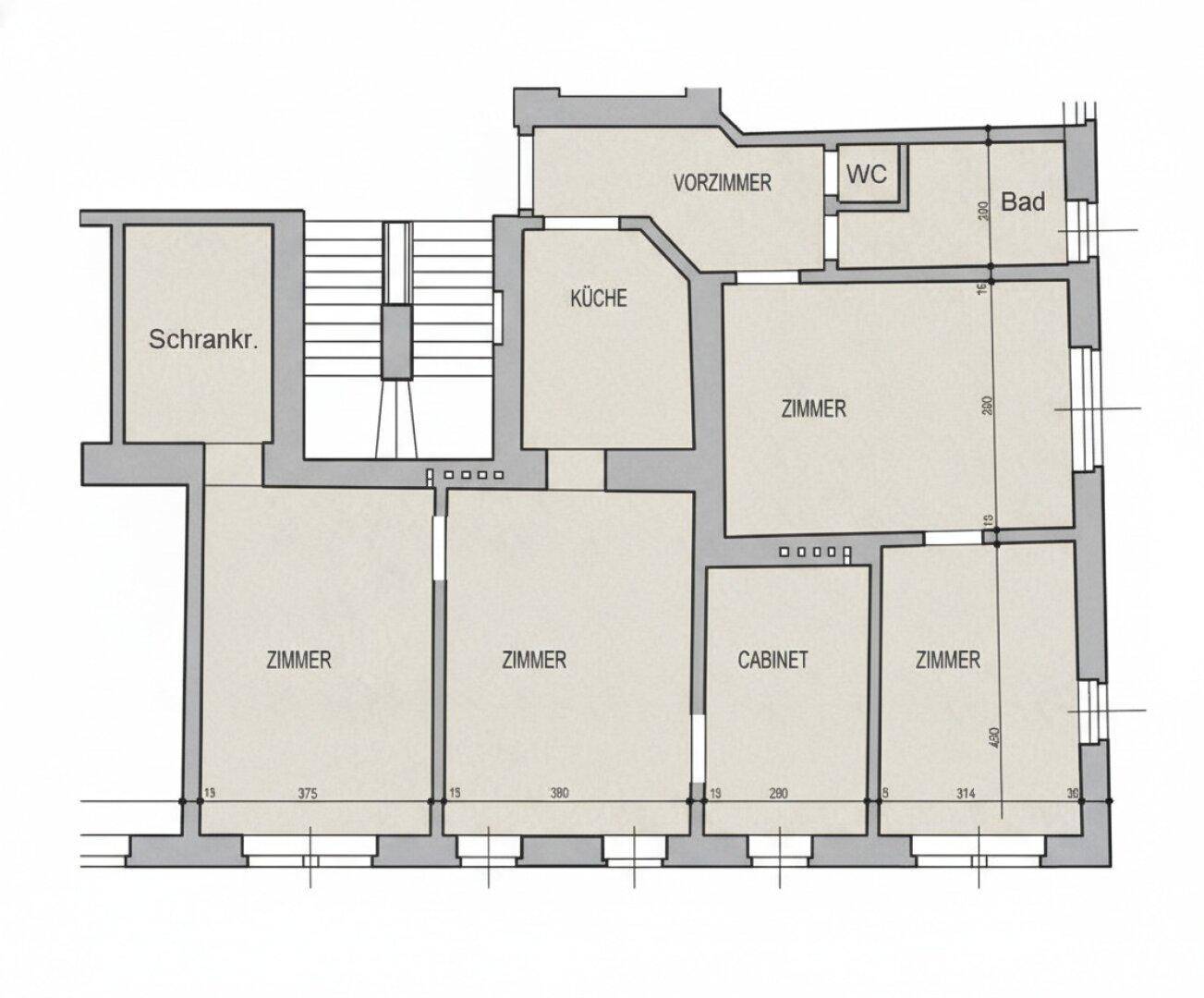 Grundriss einer Wohnung mit mehreren Zimmern, Küche, Bad und separatem WC.