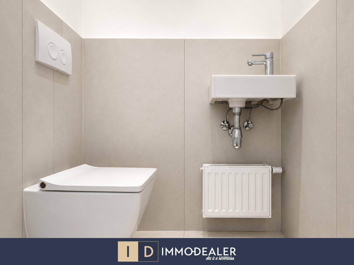 Modernes Gäste-WC mit wandhängender Toilette und kleinem Waschbecken.