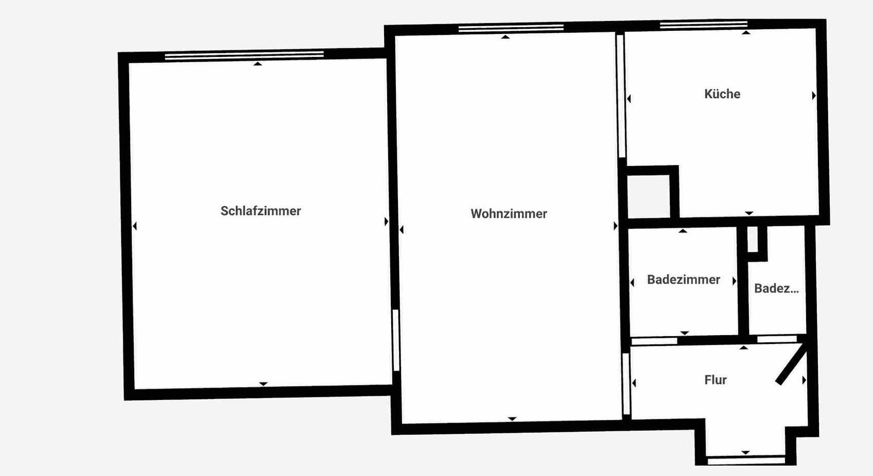 Grundriss der Wohnung mit Schlafzimmer, Wohnzimmer, Küche und zwei Badezimmern.