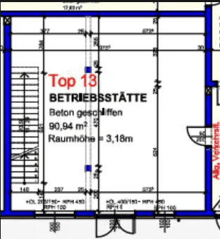 Grundriss einer Betriebsstätte mit Treppenhaus und offener Raumaufteilung.