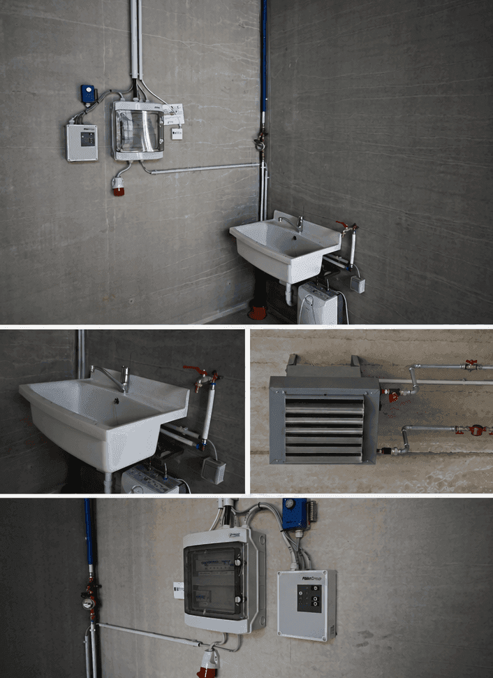 Detailansicht der technischen Installationen in einem Hauswirtschaftsraum mit Waschbecken, Leitungen und Elektroverteilung.